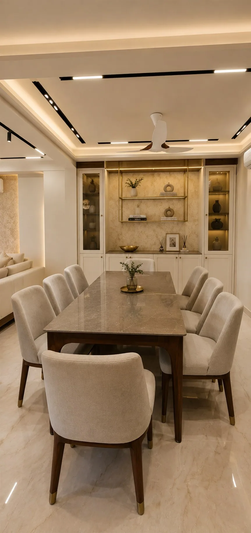 Dining room with display cabinets and brass shelving — Mr Mohak residence
